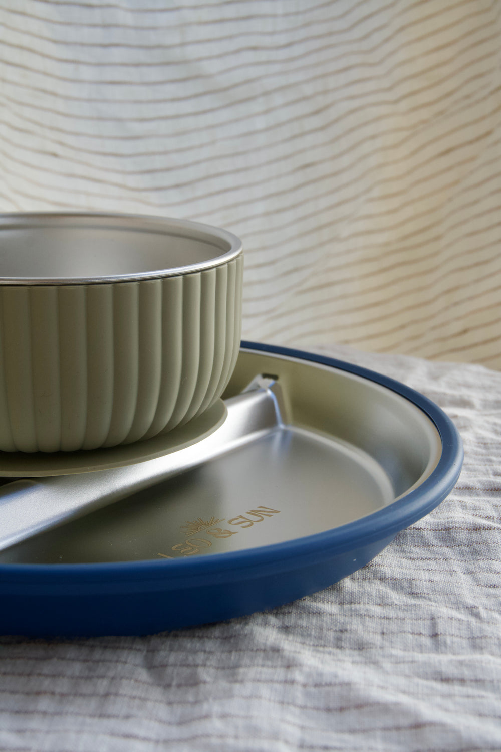 Stainless steel plate, bowl, and cup. 